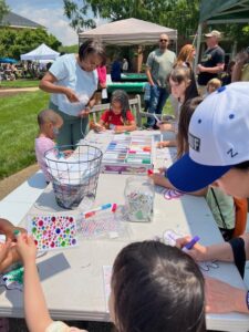 Kids working on craft projects at Nature Fest 2025.